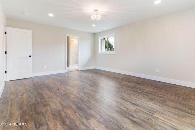 empty room featuring dark hardwood / wood-style floors