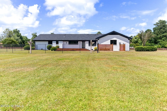 single story home featuring a front yard