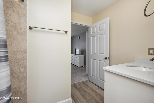 bathroom featuring vanity and hardwood / wood-style flooring