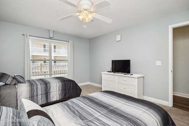 bedroom with ceiling fan and carpet