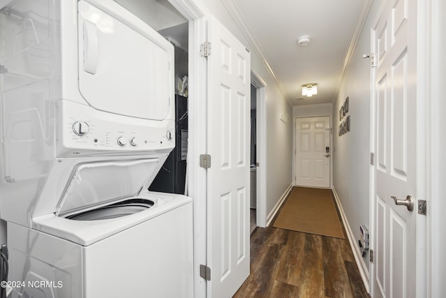 laundry area with crown molding, stacked washer and dryer, and dark hardwood / wood-style floors