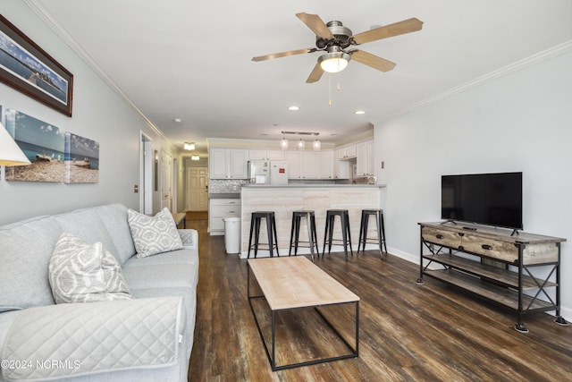 living room with crown molding, ceiling fan, and dark wood-type flooring