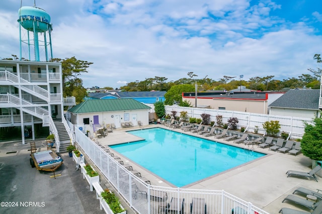 view of swimming pool with a patio area