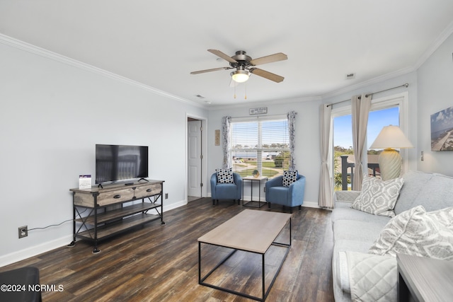 living room with dark hardwood / wood-style flooring, ceiling fan, and crown molding