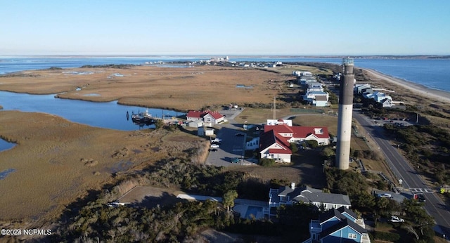 drone / aerial view featuring a view of the beach and a water view