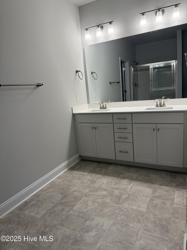 bathroom with an enclosed shower and vanity