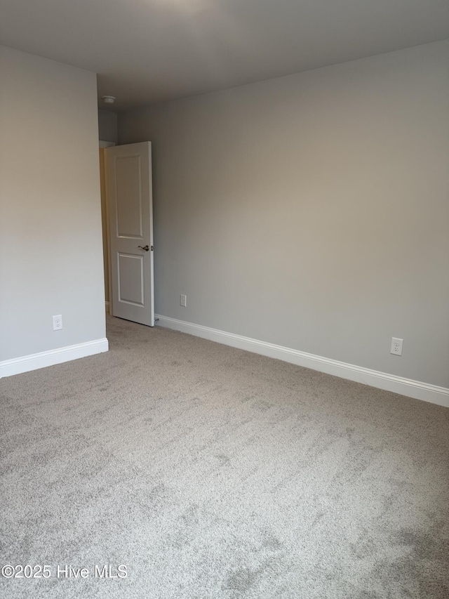 empty room with carpet flooring