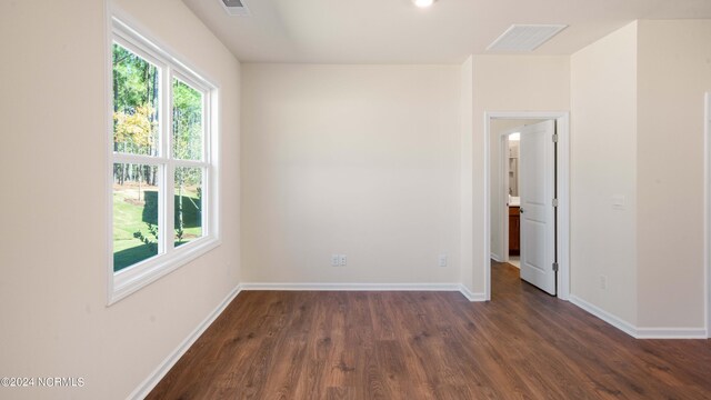 empty room featuring dark hardwood / wood-style flooring