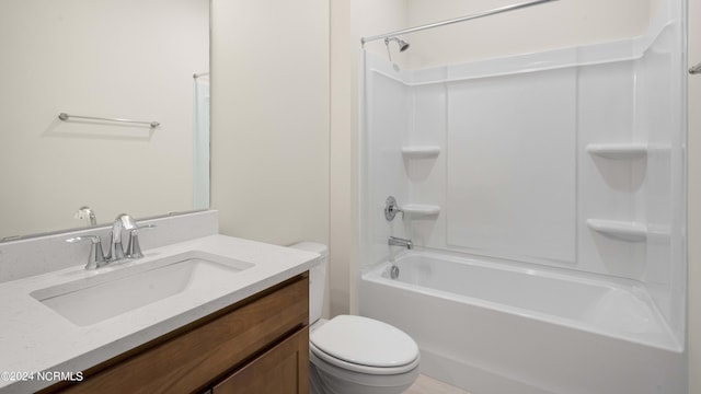 full bathroom featuring toilet, vanity, and washtub / shower combination