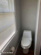 bathroom featuring toilet