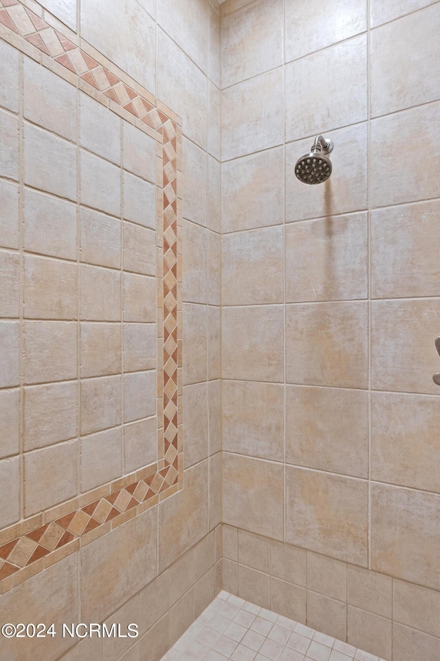 bathroom with a tile shower