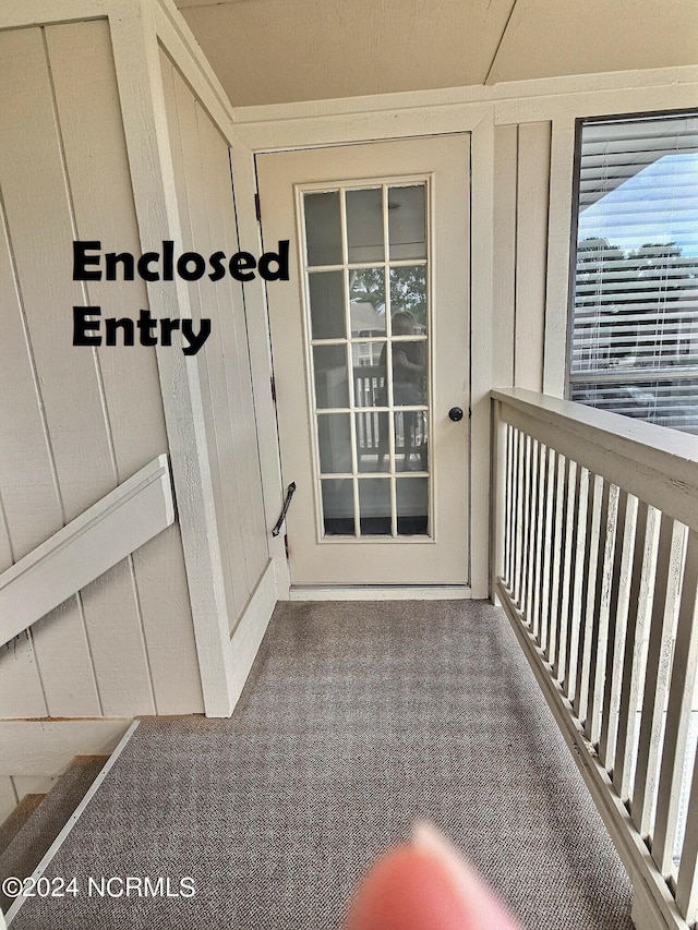 property entrance with a balcony