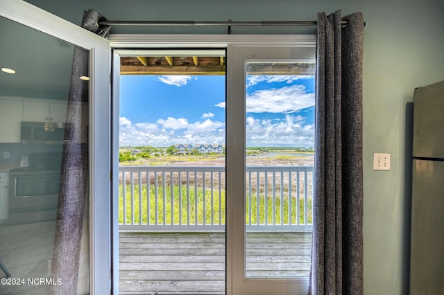 doorway to outside featuring tile patterned floors