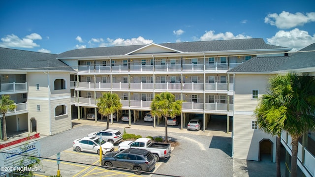 view of property with uncovered parking