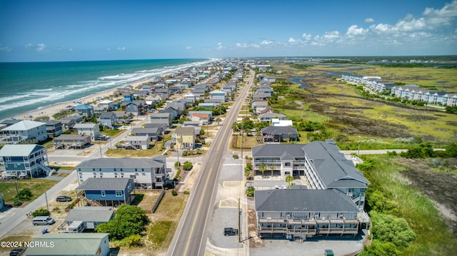 aerial view featuring a water view, a residential view, and a view of the beach