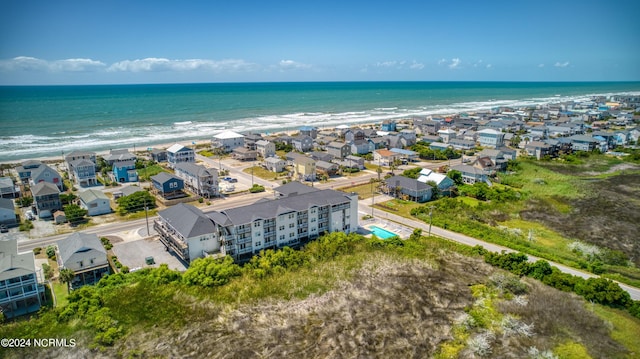 bird's eye view featuring a residential view and a water view