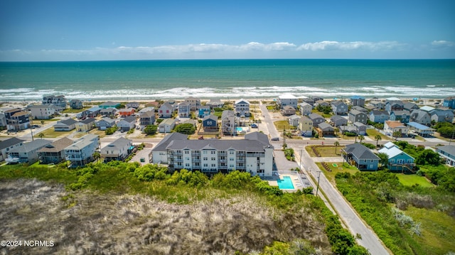 drone / aerial view featuring a water view and a residential view