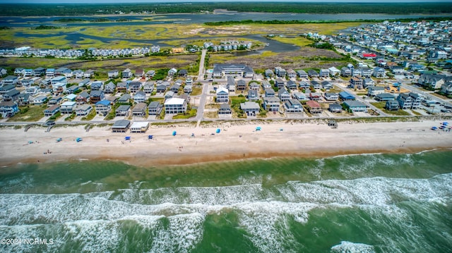 bird's eye view with a water view, a residential view, and a view of the beach