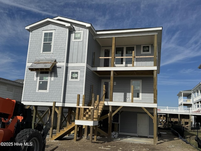 back of property featuring a balcony