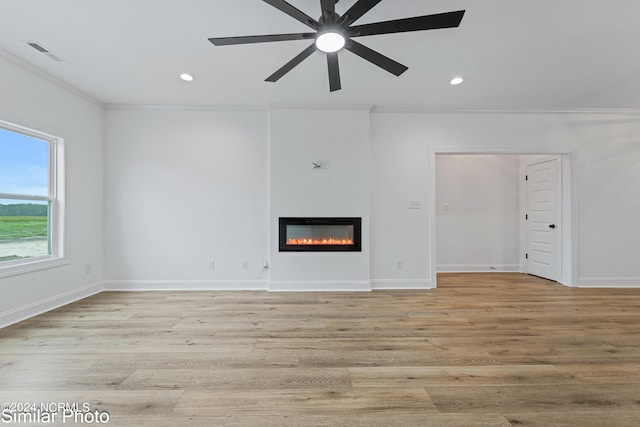 unfurnished living room with light wood-type flooring, crown molding, and ceiling fan