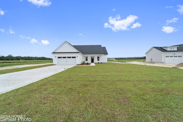 view of front of home featuring a front lawn and a garage