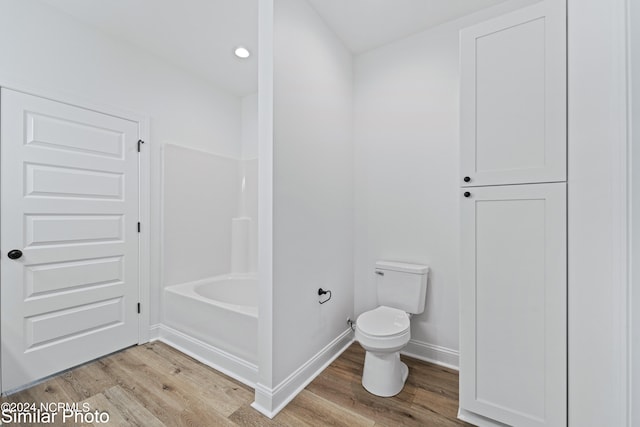 bathroom with separate shower and tub, hardwood / wood-style flooring, and toilet