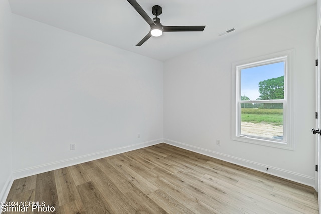 spare room with ceiling fan and light hardwood / wood-style floors