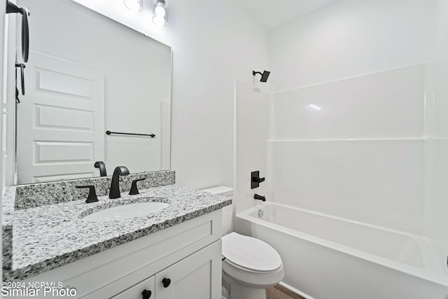 full bathroom featuring shower / washtub combination, vanity, and toilet