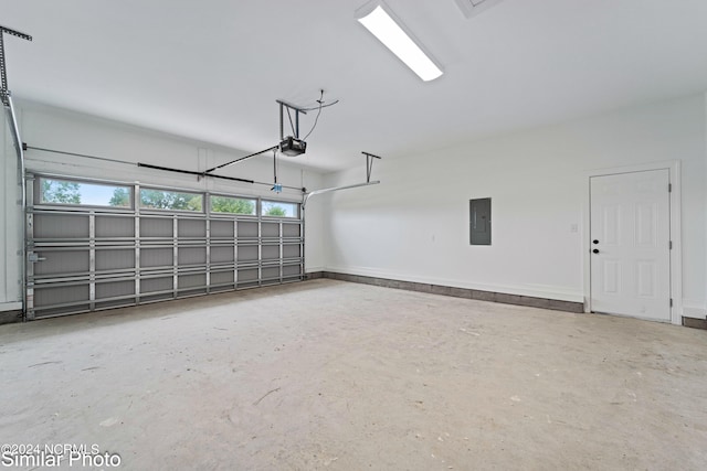 garage featuring a garage door opener and electric panel