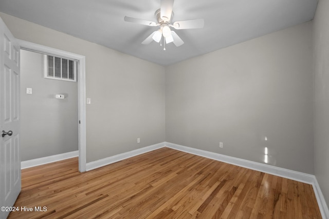 unfurnished room with ceiling fan and light hardwood / wood-style flooring