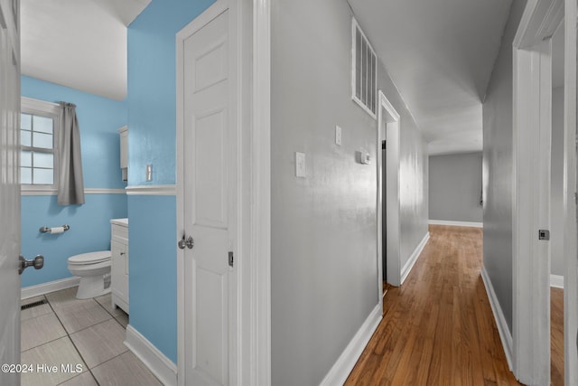 corridor featuring light hardwood / wood-style flooring