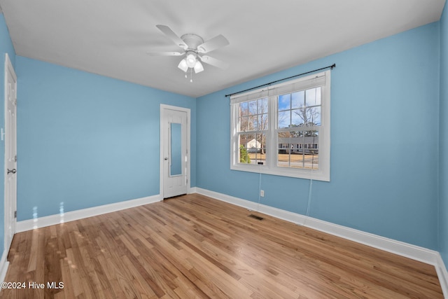 spare room with ceiling fan and light hardwood / wood-style floors