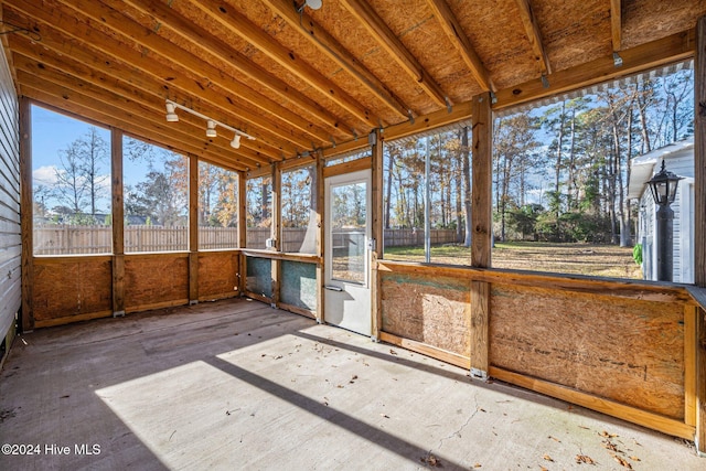 unfurnished sunroom featuring plenty of natural light