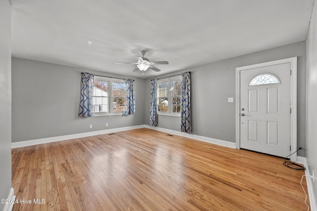 foyer featuring ceiling fan and light hardwood / wood-style flooring