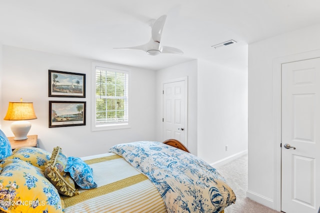 bedroom featuring light colored carpet and ceiling fan