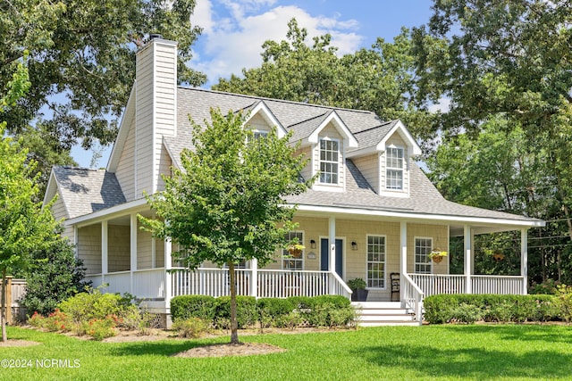 view of front of home featuring a front yard and a porch