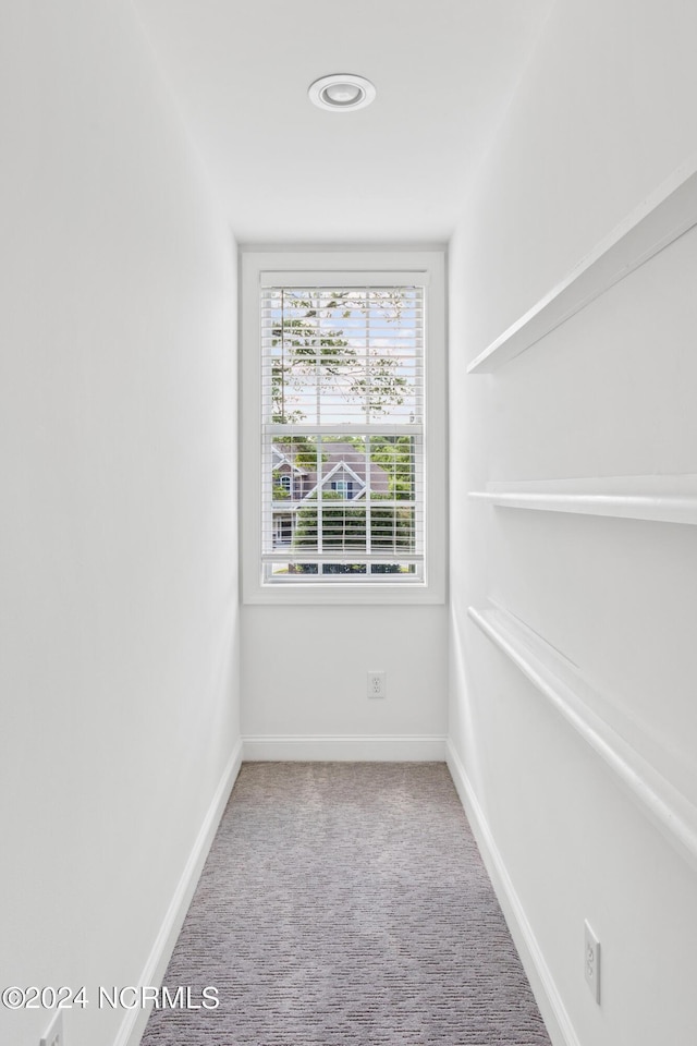 empty room with light colored carpet