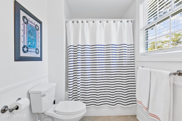 bathroom with tile patterned floors and toilet