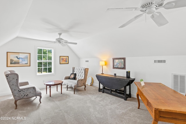 sitting room featuring vaulted ceiling, light carpet, and ceiling fan