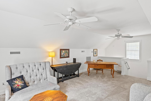 home office with ceiling fan, vaulted ceiling, and light carpet