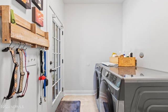 laundry room with cabinets, separate washer and dryer, and light tile patterned floors