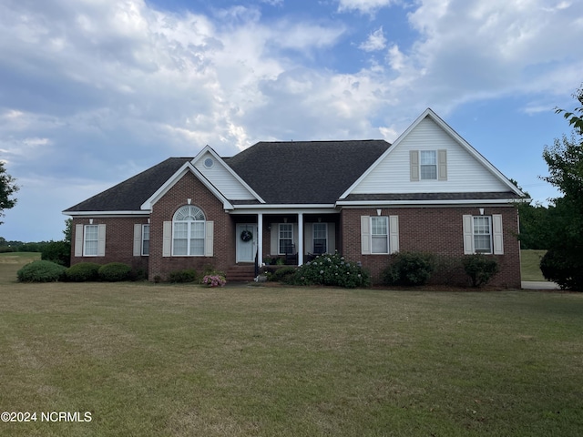 view of front of property with a front lawn and a porch