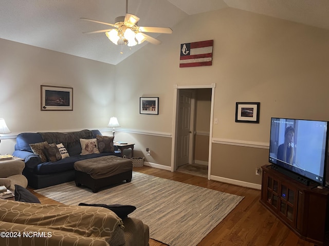 living room featuring high vaulted ceiling, hardwood / wood-style floors, and ceiling fan