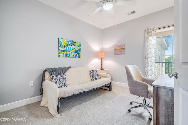 home office with ceiling fan and carpet