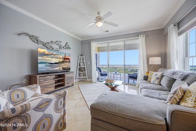 tiled living room with ceiling fan and ornamental molding