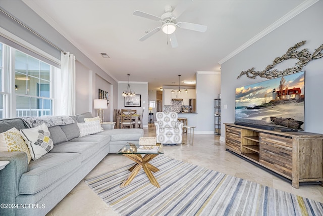 living room featuring ceiling fan with notable chandelier and crown molding