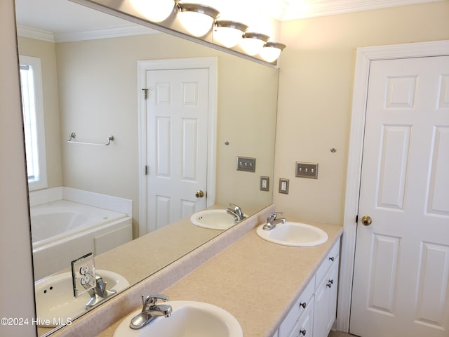 bathroom with a bathing tub, a wealth of natural light, vanity, and ornamental molding