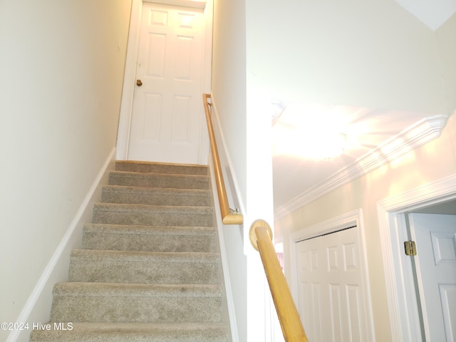 stairway with crown molding