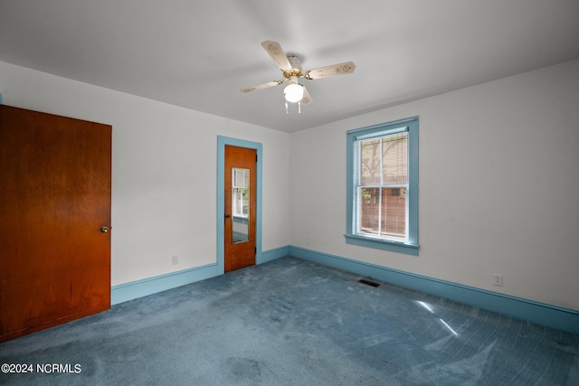 carpeted empty room with ceiling fan