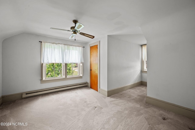 additional living space featuring ceiling fan, light colored carpet, baseboard heating, and vaulted ceiling